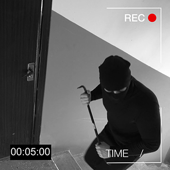 Masked burglar with crow bar caught on video surveillance 