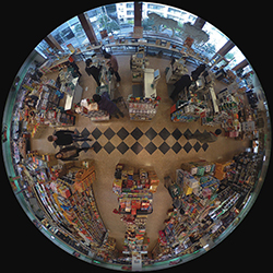 Warped 360 degree view from security camera looking down at a supermarket point of sale station